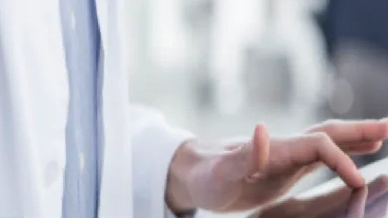 Doctors hand on a tablet